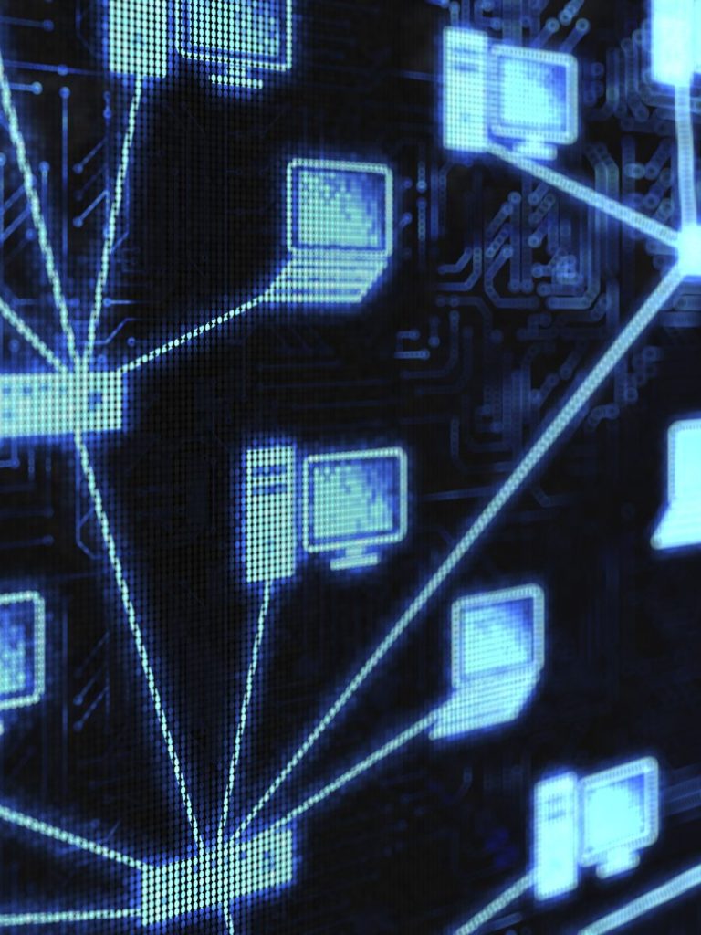 Website Design & Development Network of blue computer icons connected by lines on a dark background.